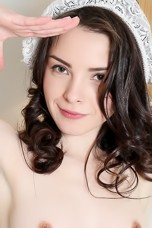 Vikki Mauri and Una Piccola tease in lingerie and nude poses across bedroom and bath scenes